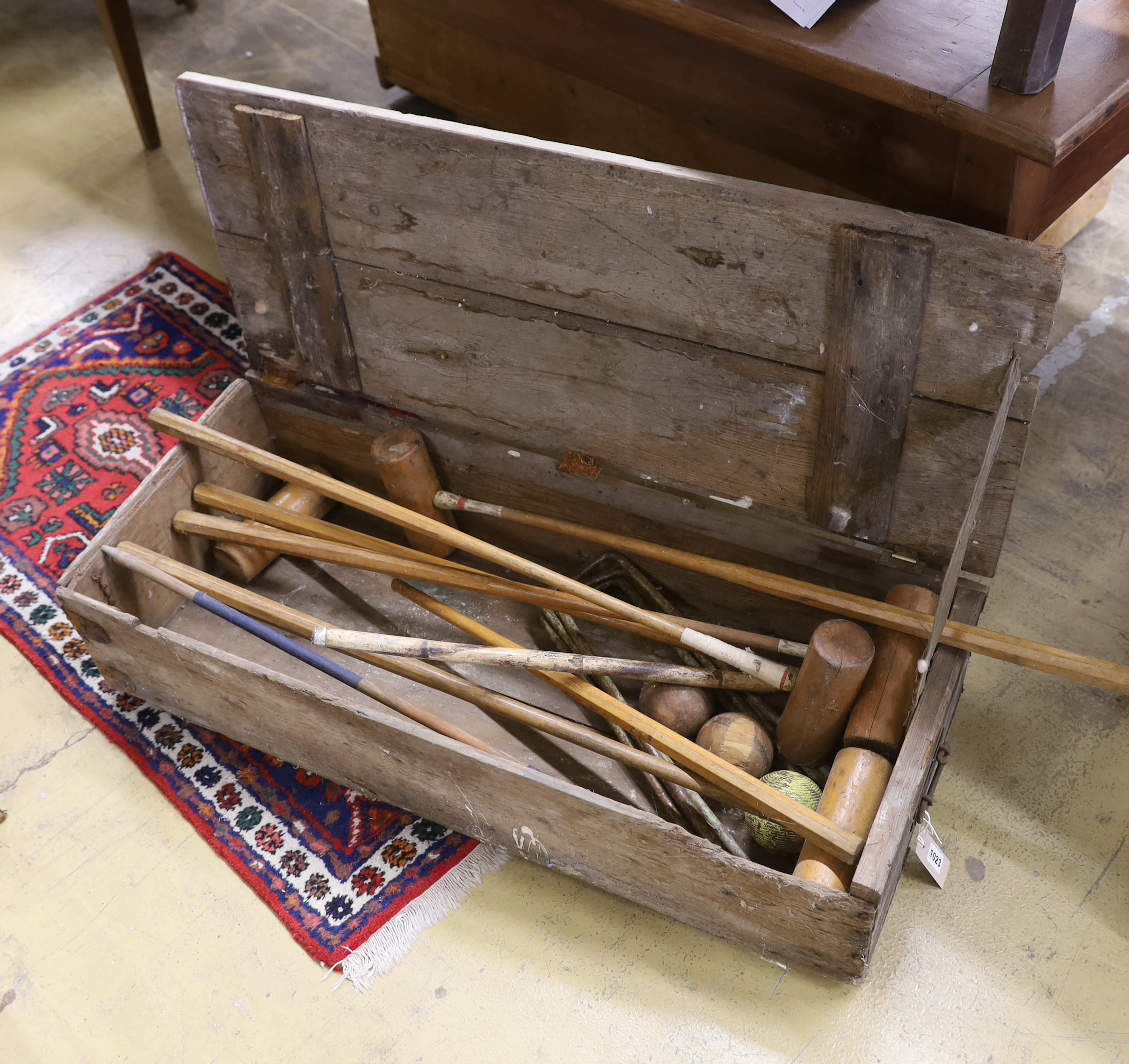 A vintage pine cased croquet set
